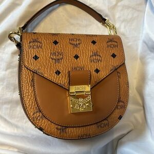 Patricia MCM. Excellent Condition. Comes with strap and dust bag.